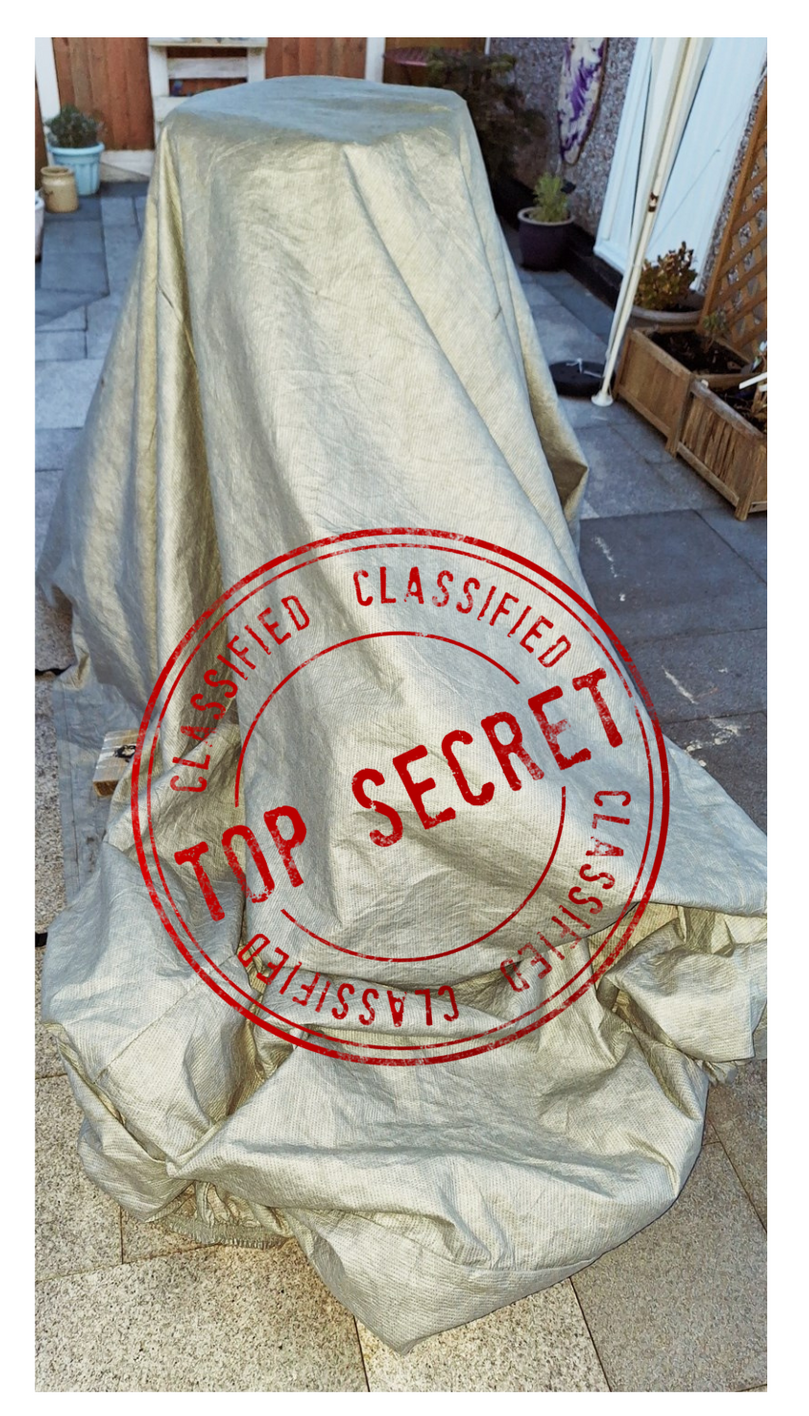 A top secret stamp is on a piece of cloth