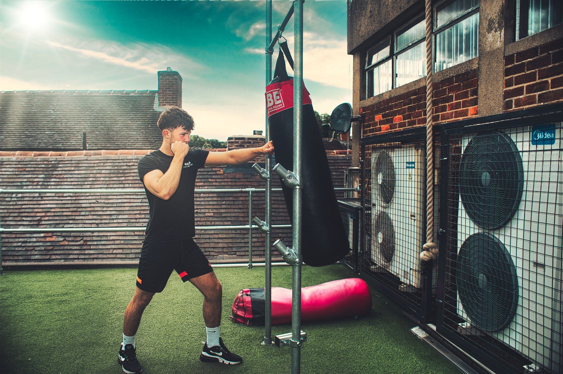 man punching a punching bag