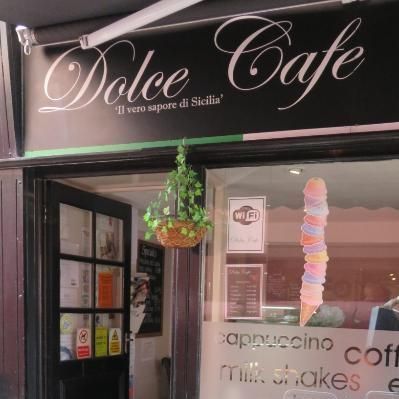 A store front with a sign that says dolce cafe