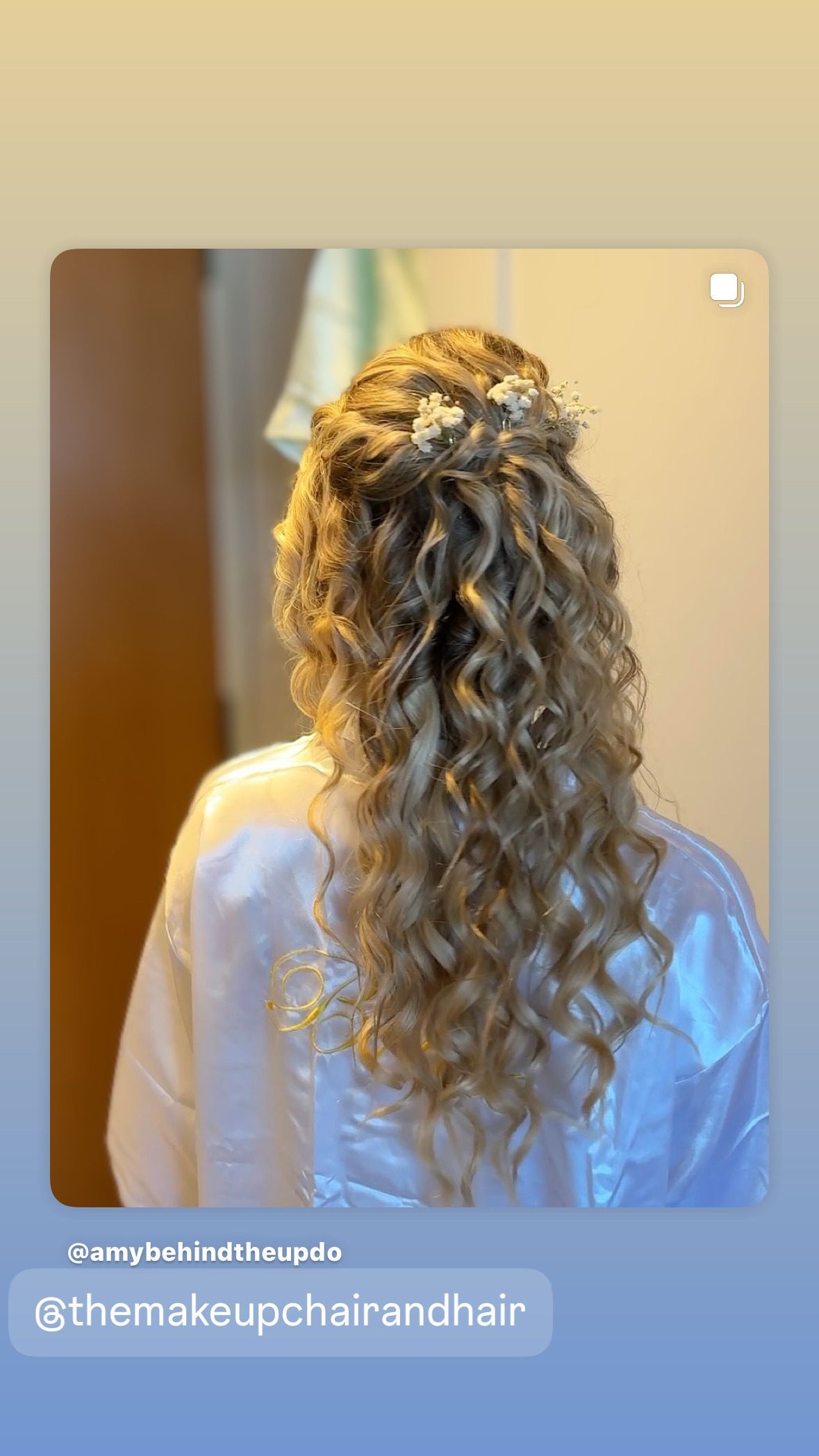 Blonde hair updo with a braid, adorned with floral hair accessories.