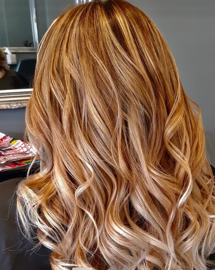 A Woman With Long Blonde Hair — Embellish Hair and Beauty In Slade Point, QLD