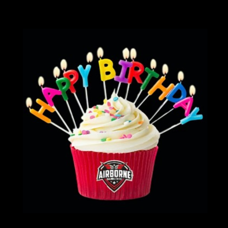 A cupcake with candles that say happy birthday