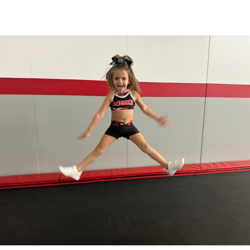 young girl gymnast jumping