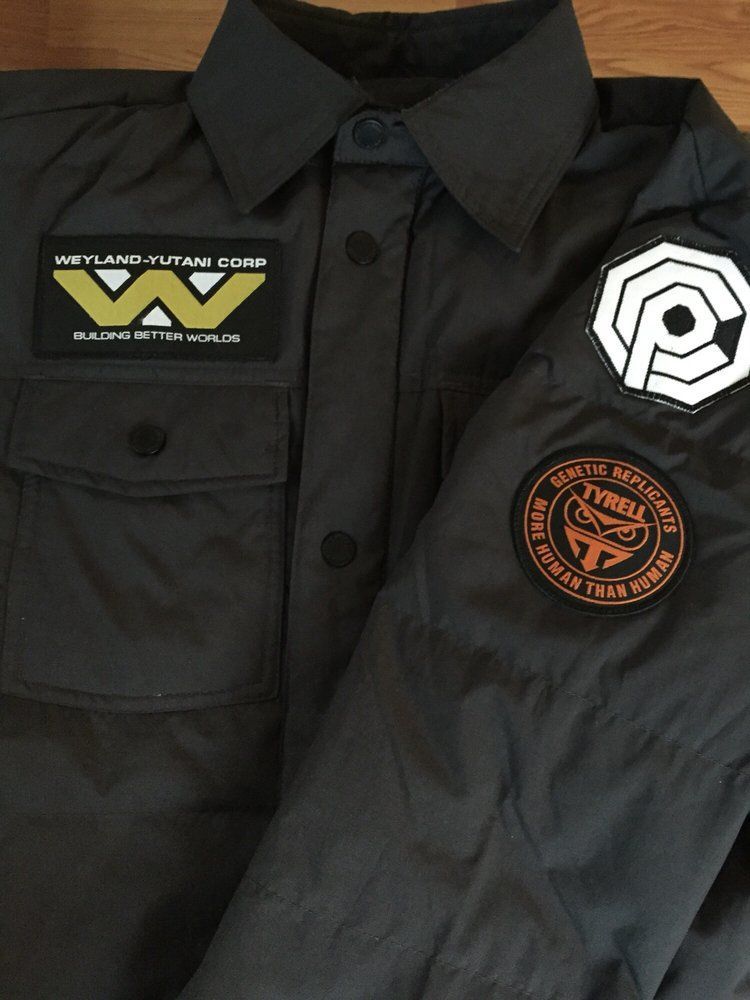 A woman is trying on a wedding dress in front of a mirror.