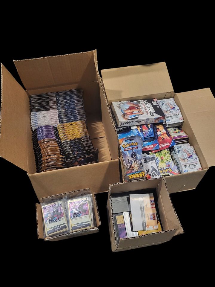 A cardboard box filled with lots of different types of cards.