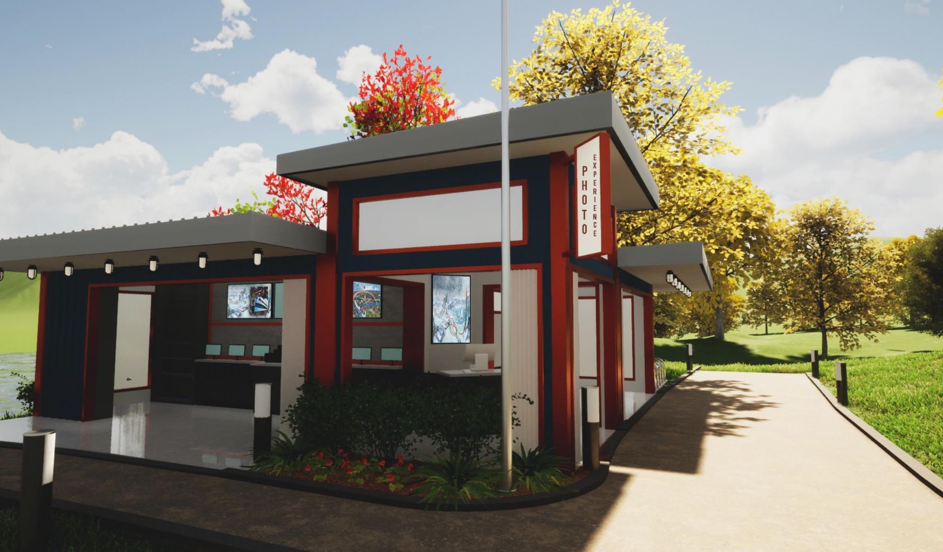 A red and gray park information booth with a sign, set against a backdrop of trees and grass.