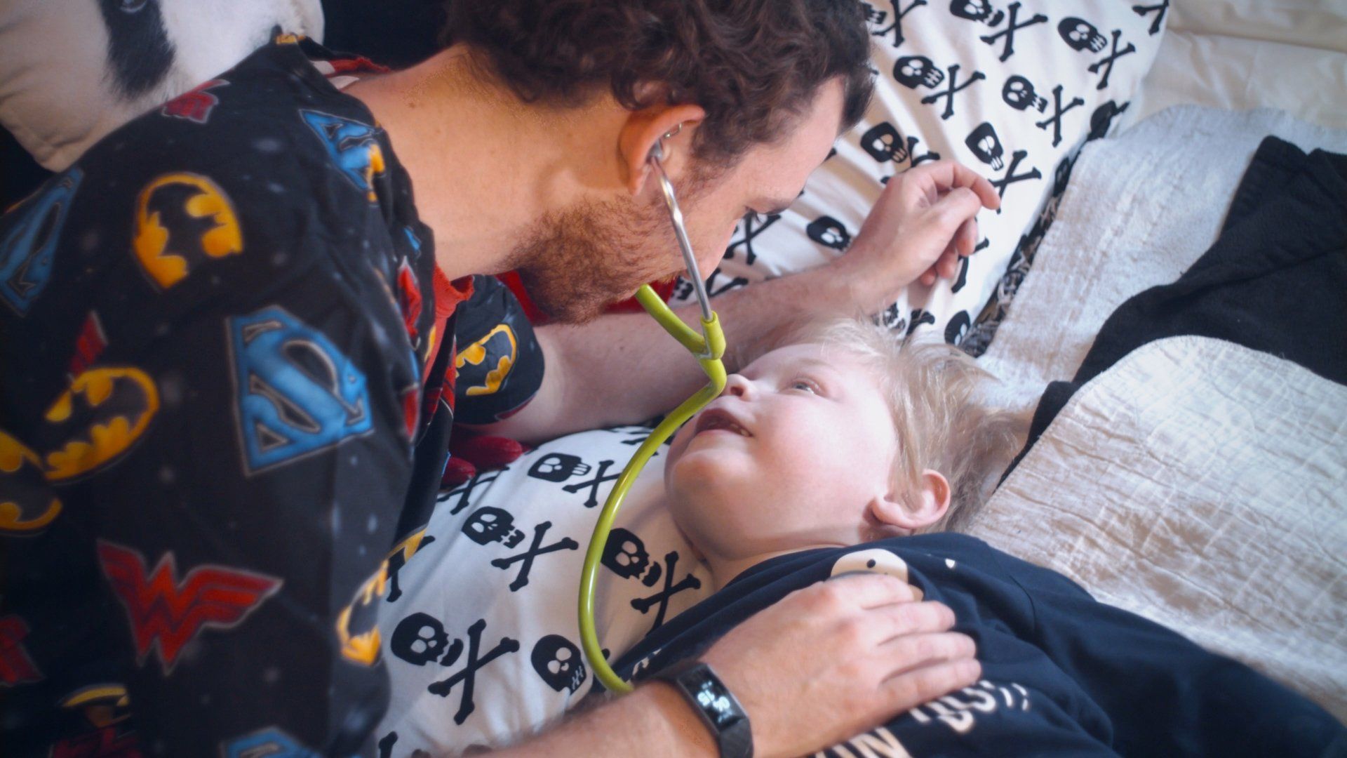 Our Vision image - Nurse with young child caring for him