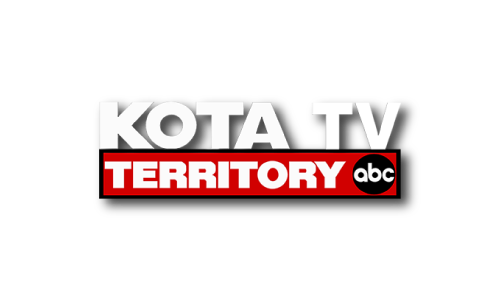 Logo that says KOTA TV in white and Territory in a red box with a black circle with the letters abc in white inside. 