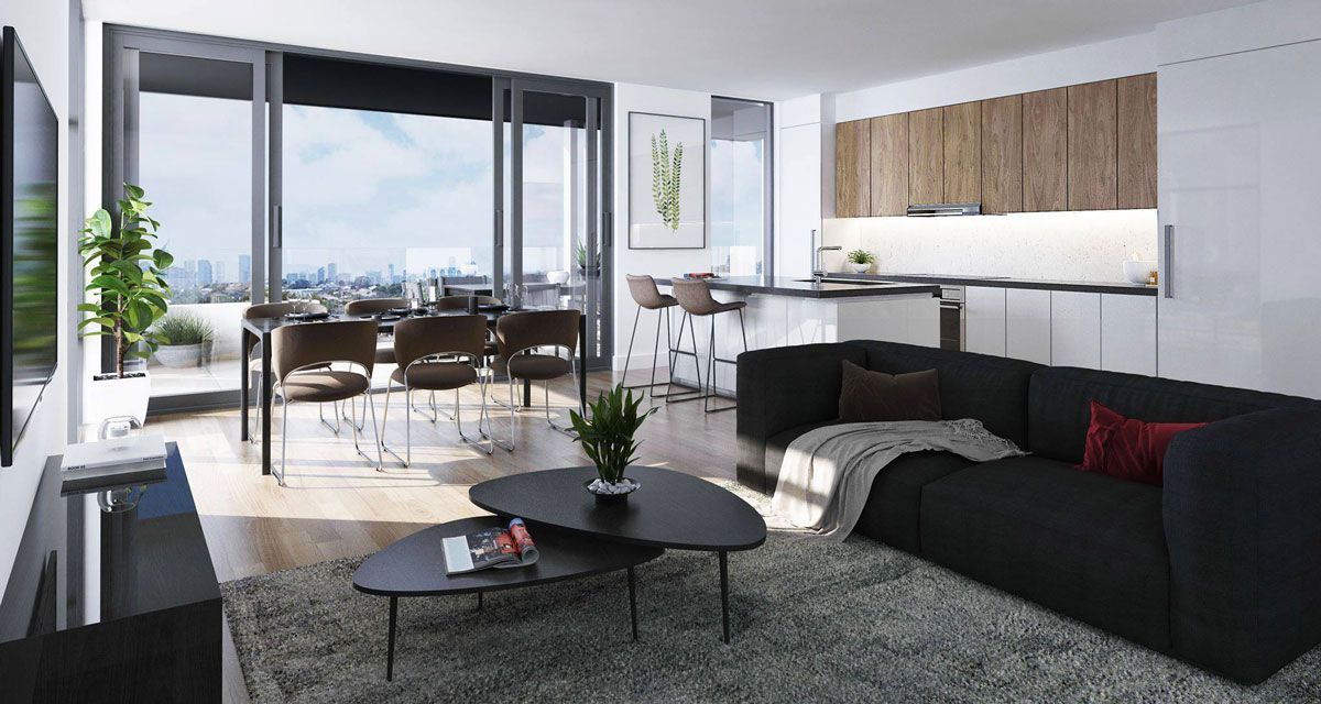 A living room with a black couch and two coffee tables at Ilios Living in Como.