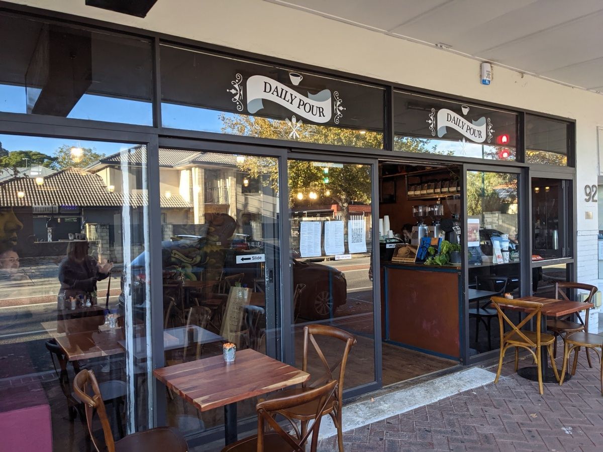 Ilios Living accommodation for people with disabilities – A restaurant with tables and chairs outside of it near our Carlisle location.