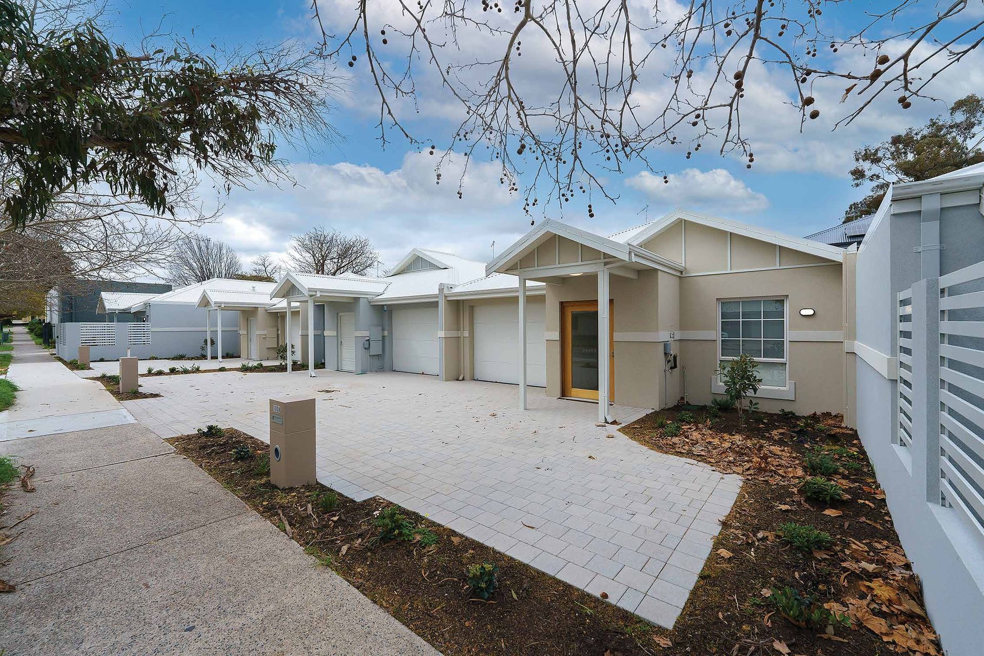 A row of houses are lined up next to each other from one of the Ilios Living accommodation buildings.