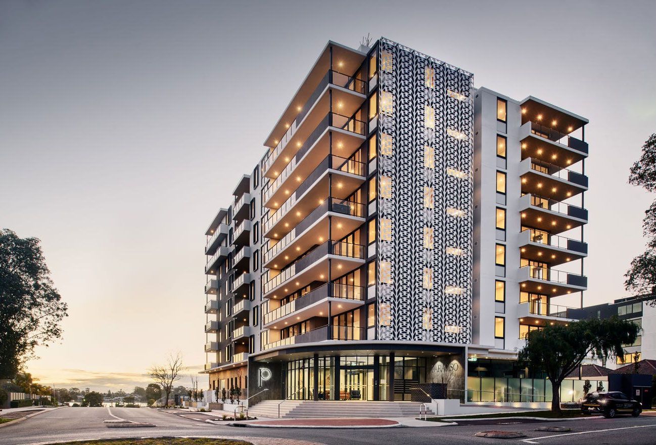 An artist 's impression of a tall building with a lot of windows and balconies at Ilios Living in Como.