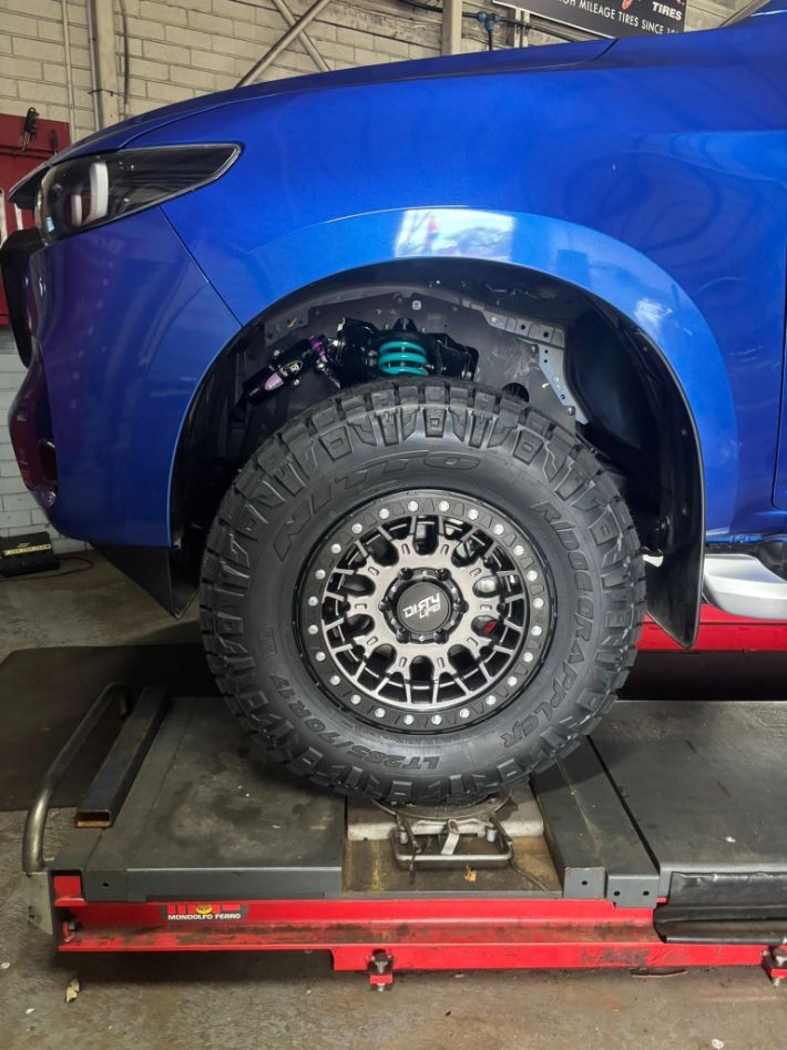 Blue Car Front Wheel — Level Up Automotive In Unanderra, NSW