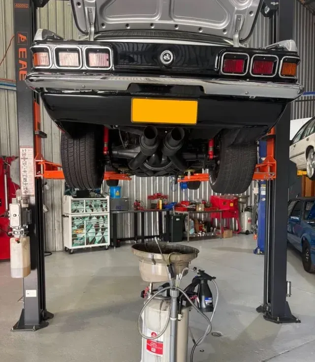 Car on A Lift in A Garage — Level Up Automotive In Figtree, NSW