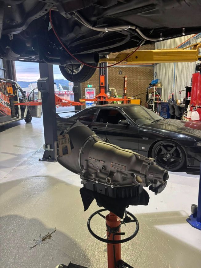Transmission on A Lift, Beneath a Car — Level Up Automotive In Unanderra, NSW