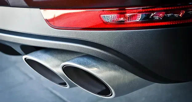 A Chrome Twin Exhaust Pipe of A Car — Level Up Automotive In Unanderra, NSW