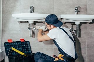 Plumber Service — Plumber Fixing Toilet Sink Pipes in Hockessin, DE