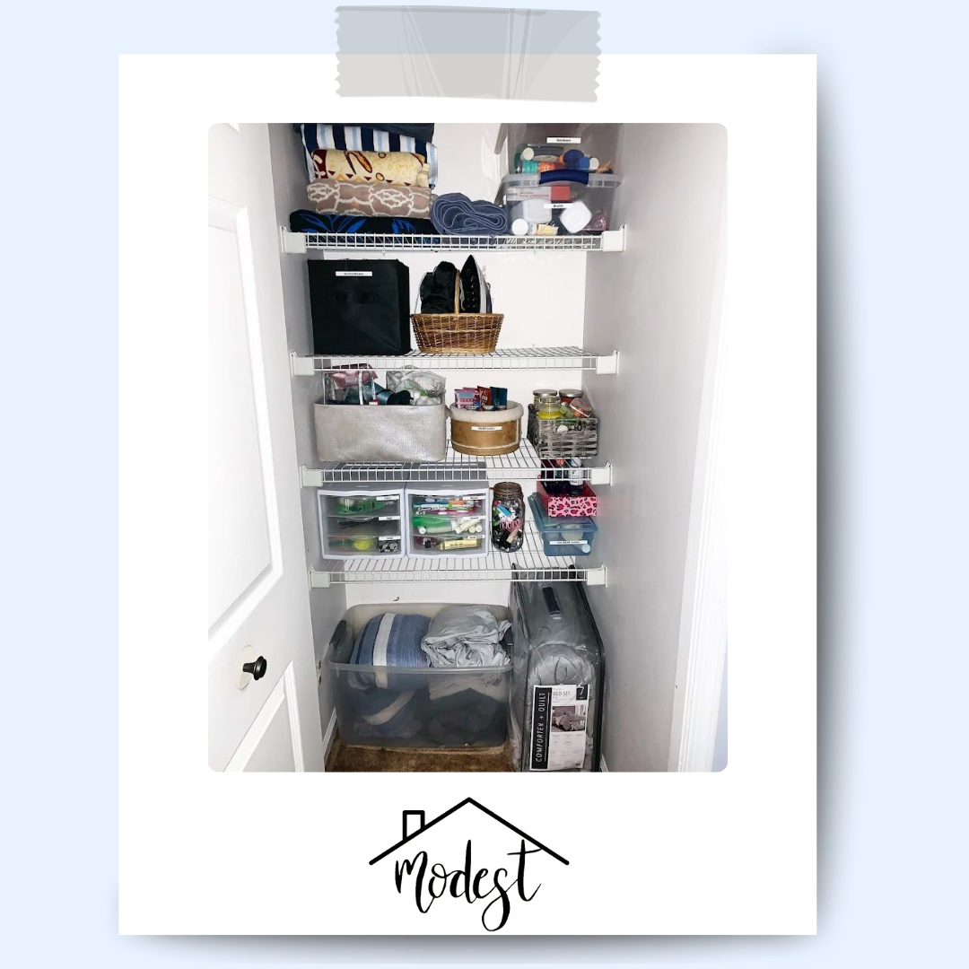 Organized white closet with wire shelving and various stored items in bins and baskets.