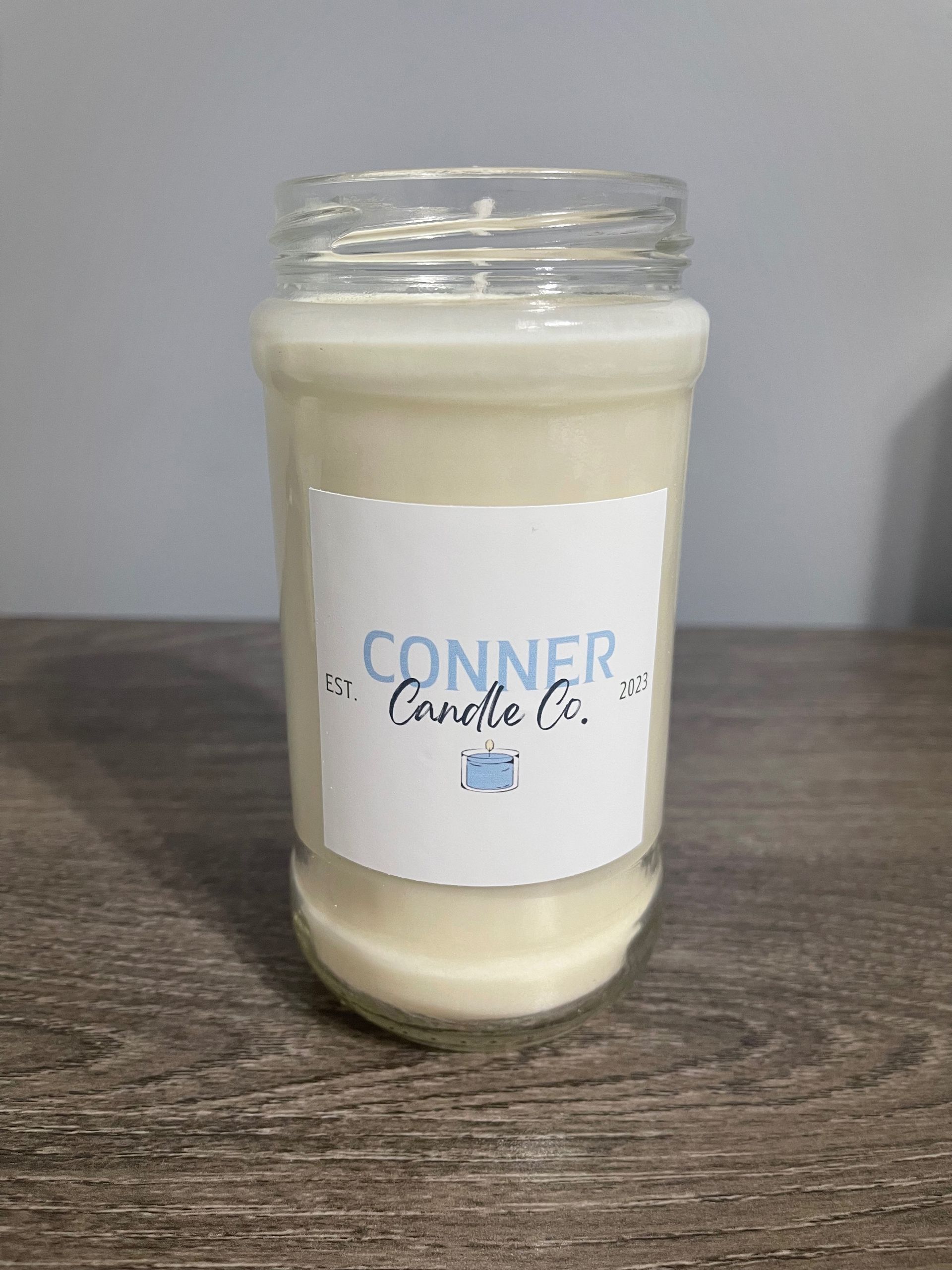 Glass jar candle with white wax, a 