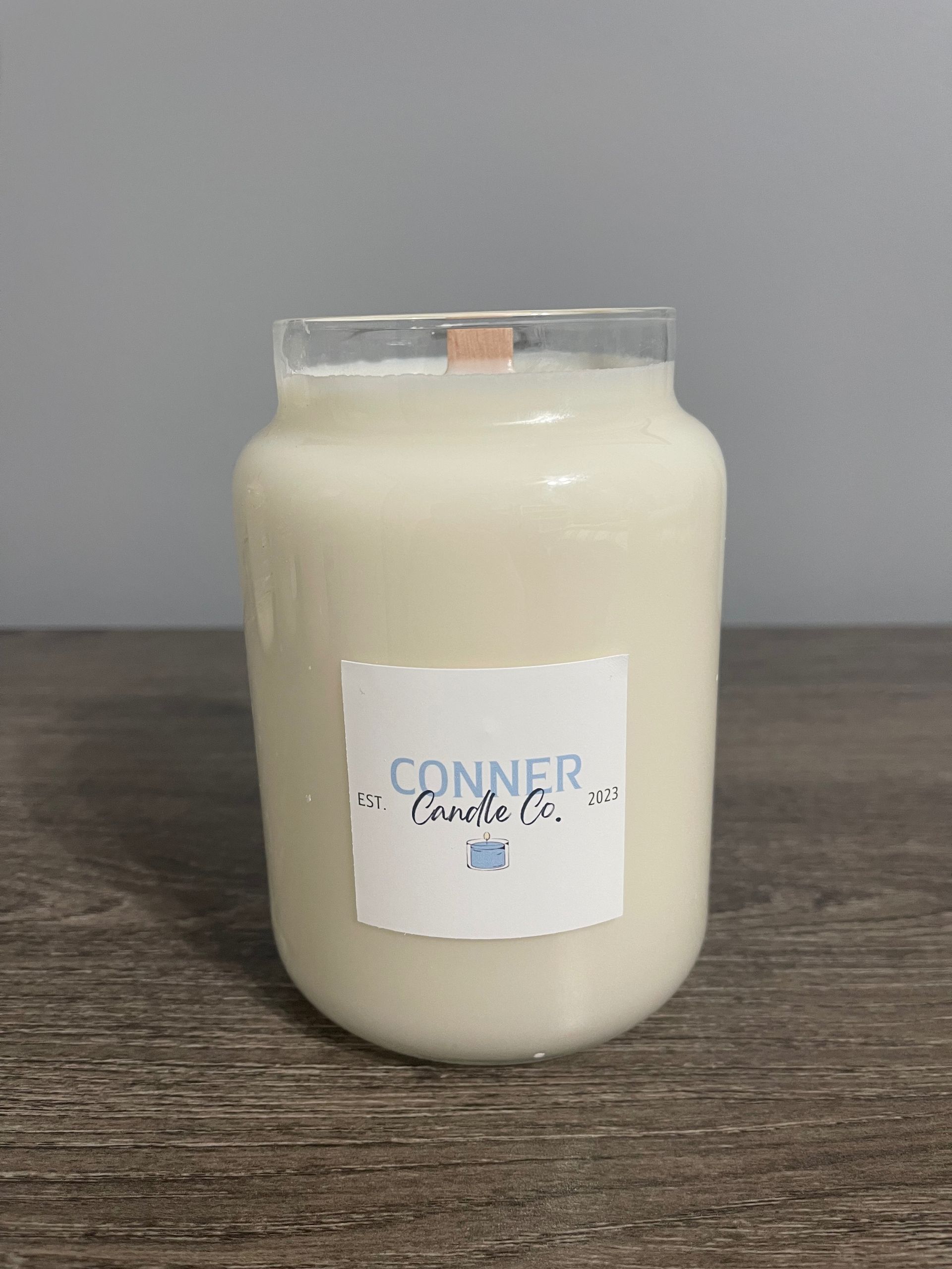 White candle in a jar with 