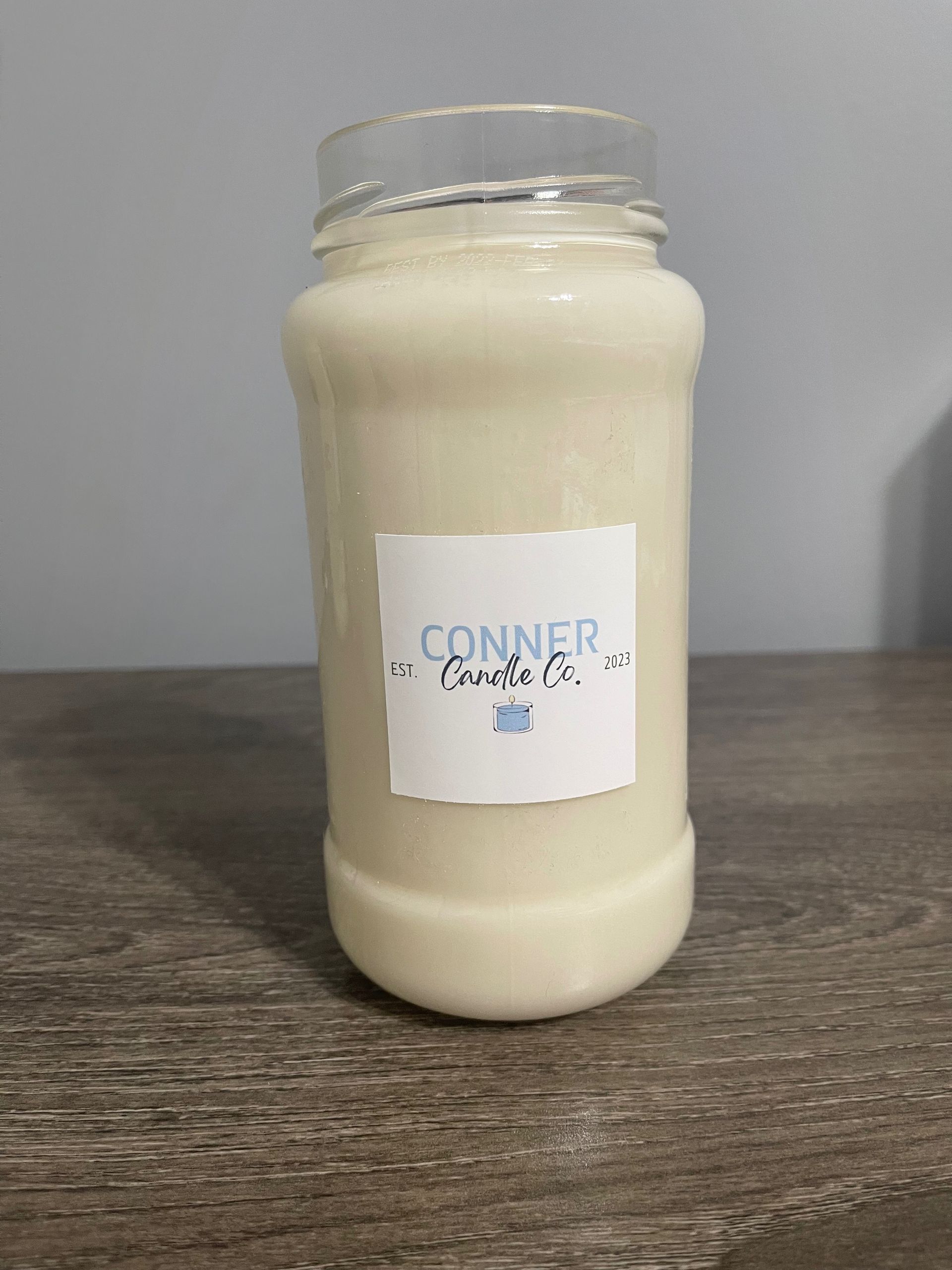 Jar of creamy liquid with a label that says 