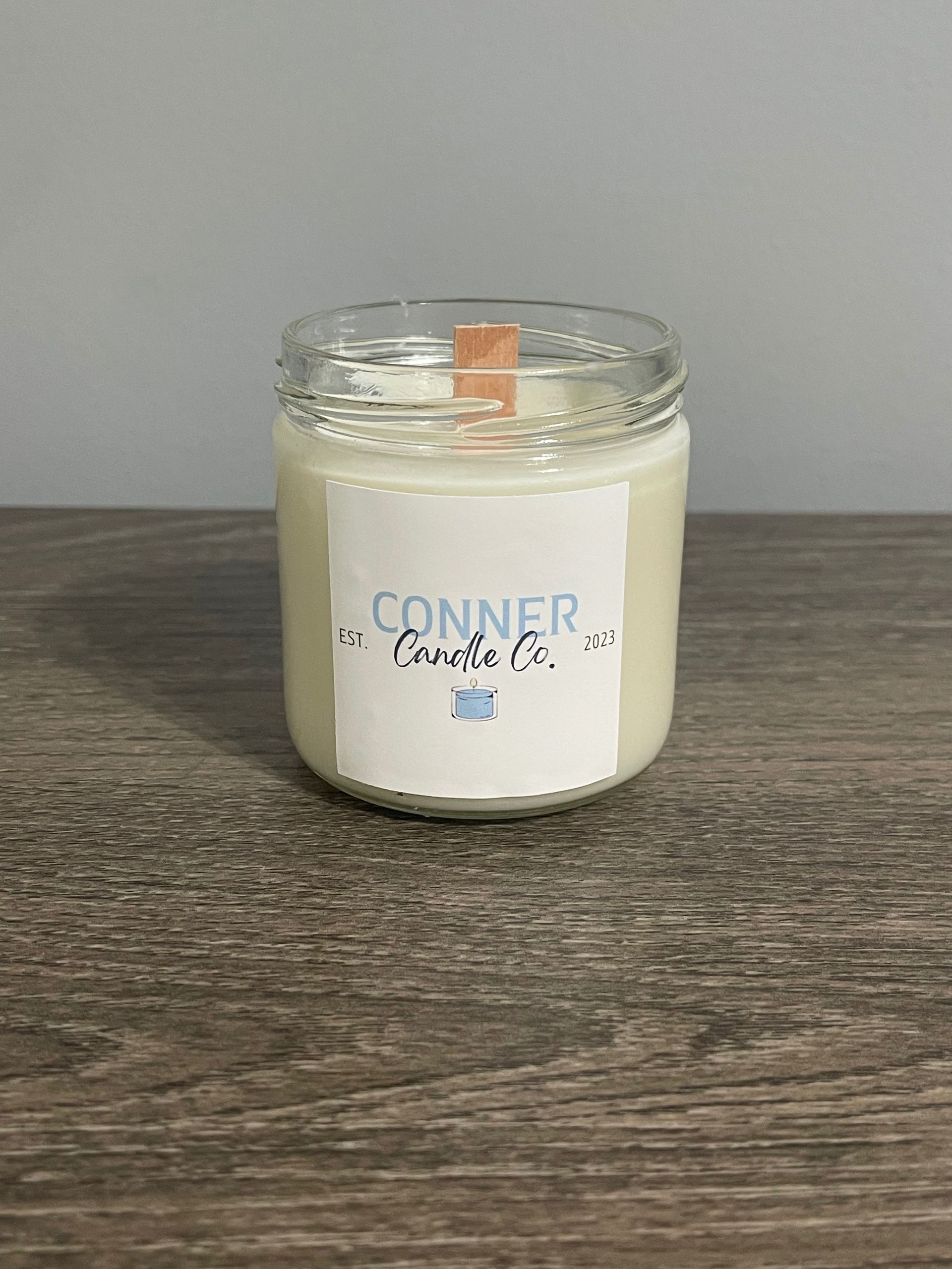 Candle in a jar with a label that says 