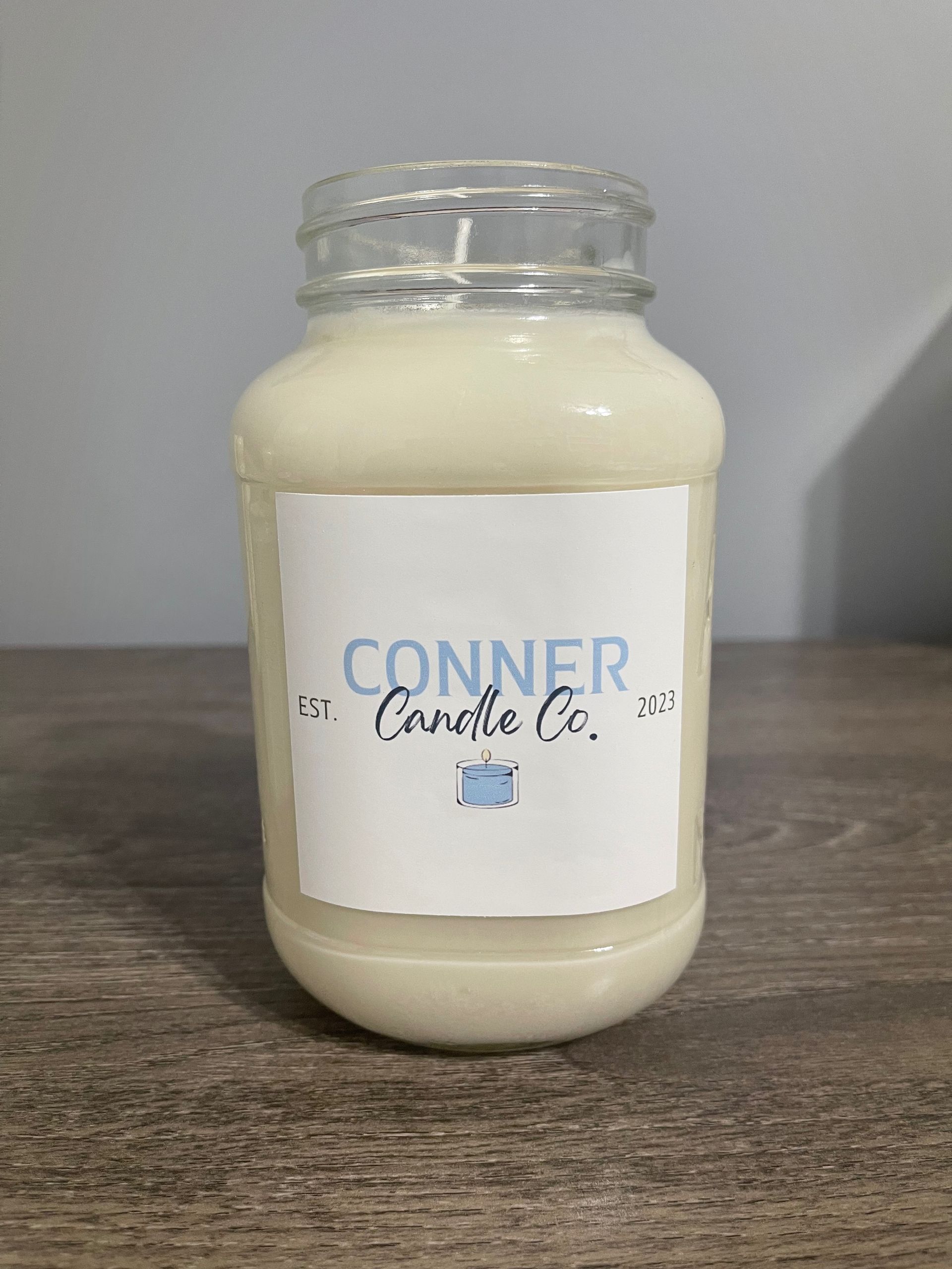 Candle in a jar with label 