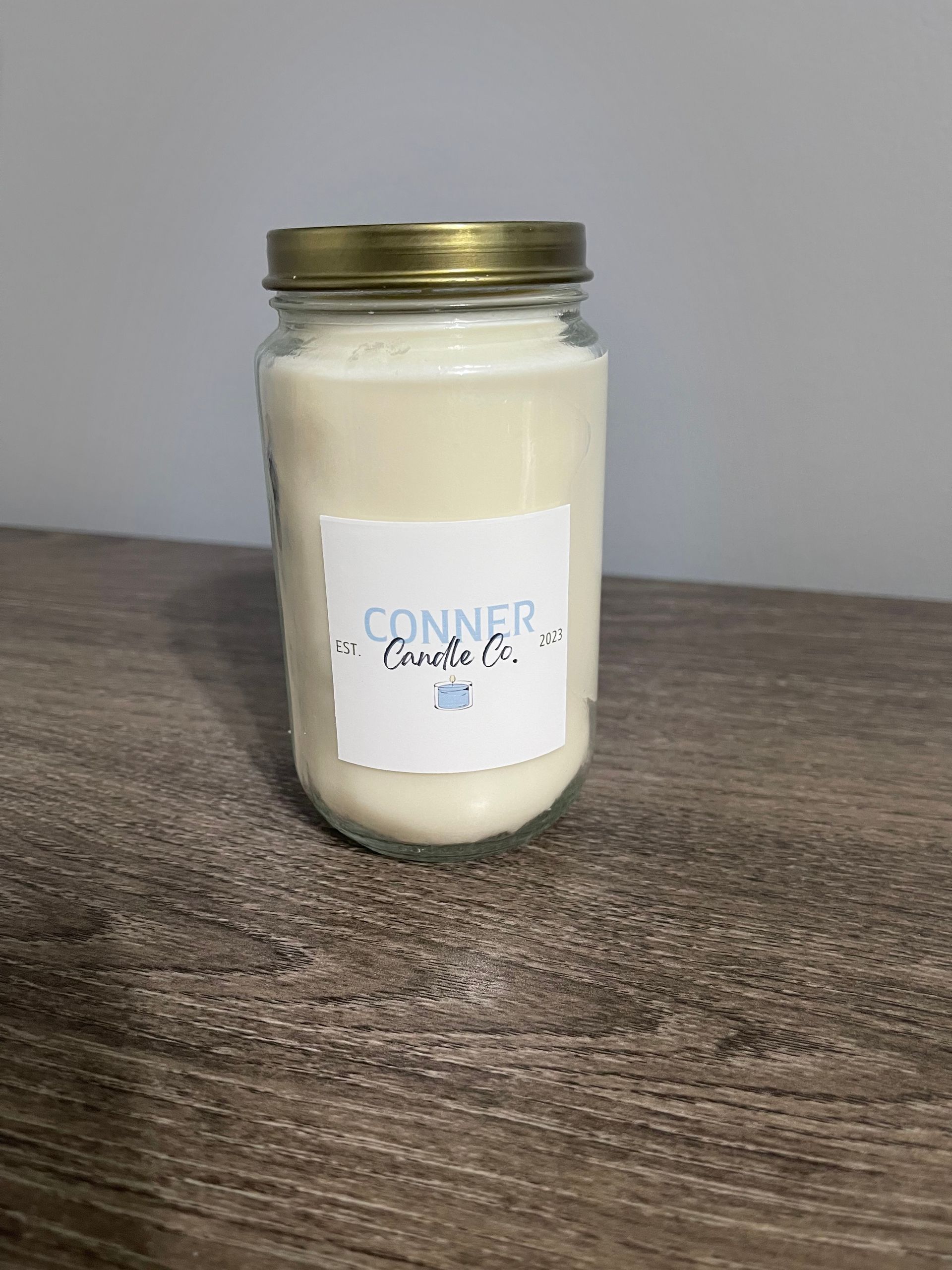 Jar with white liquid and a label that reads 