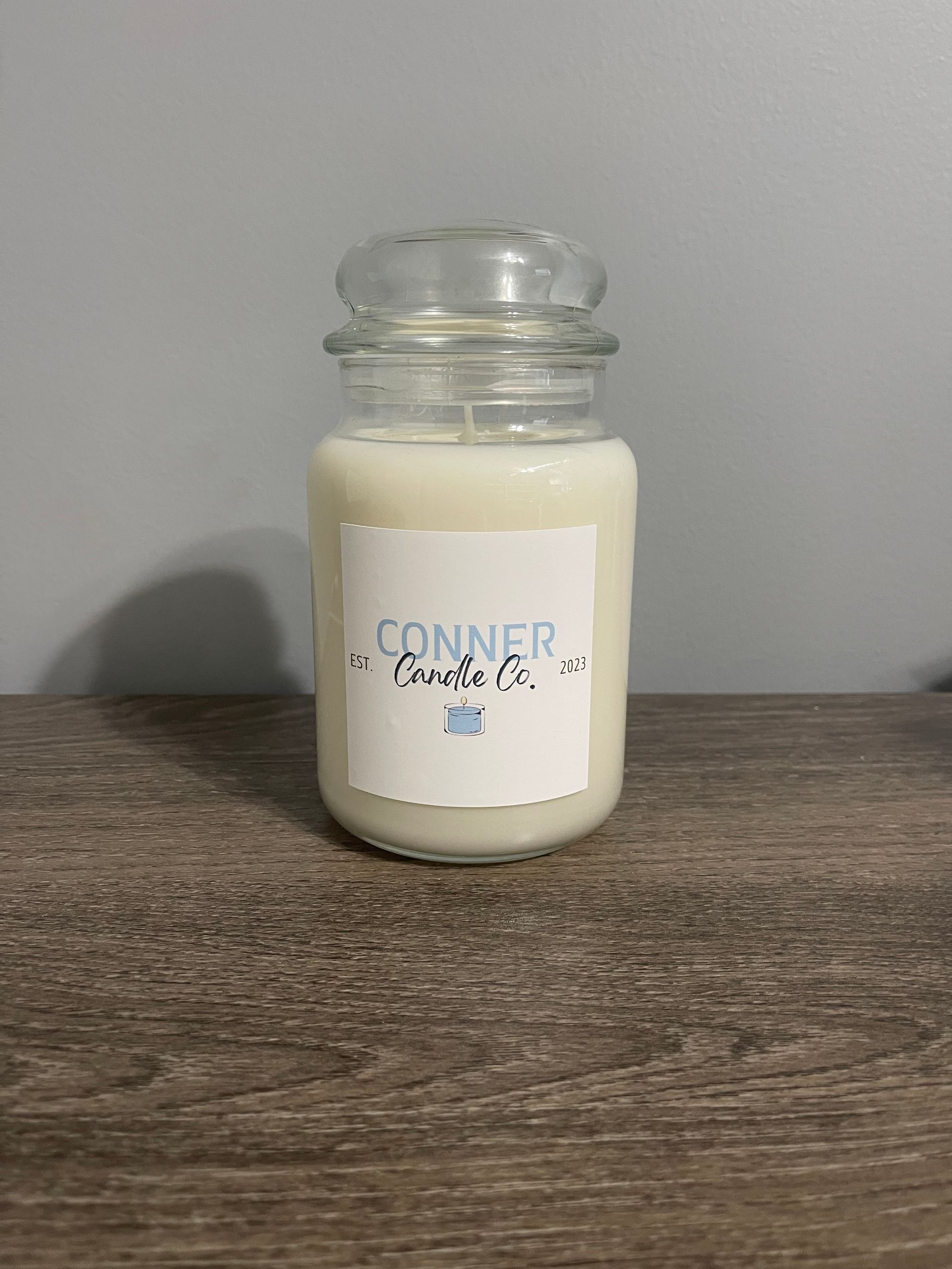 Jar candle with a label that says, 