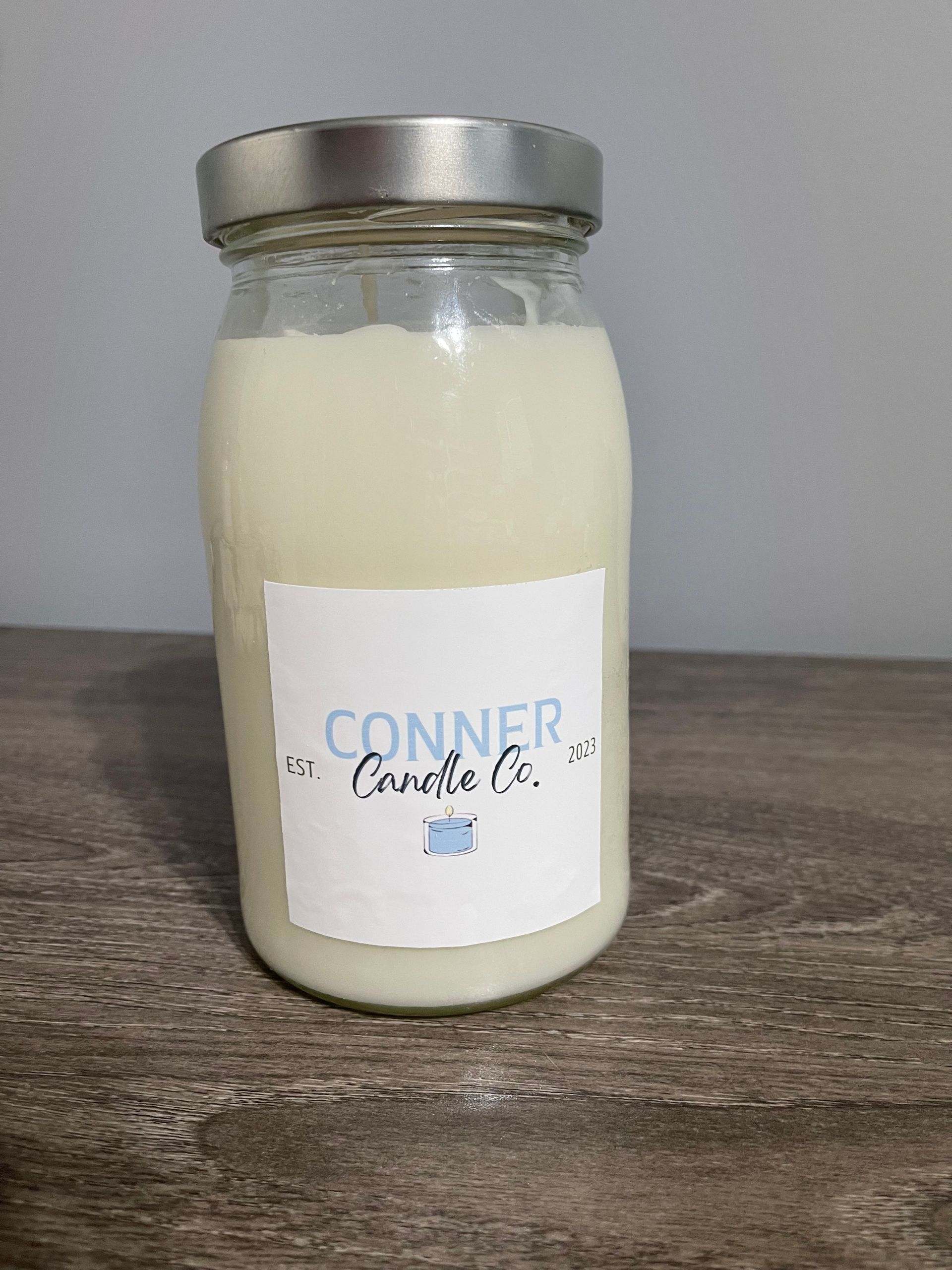Jar candle with a label that says 
