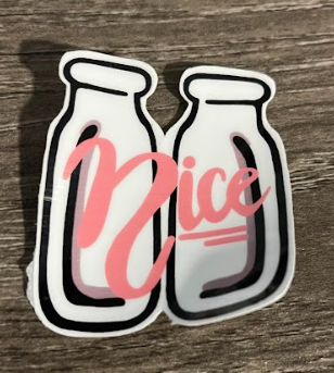 Two white milk bottles with pink 