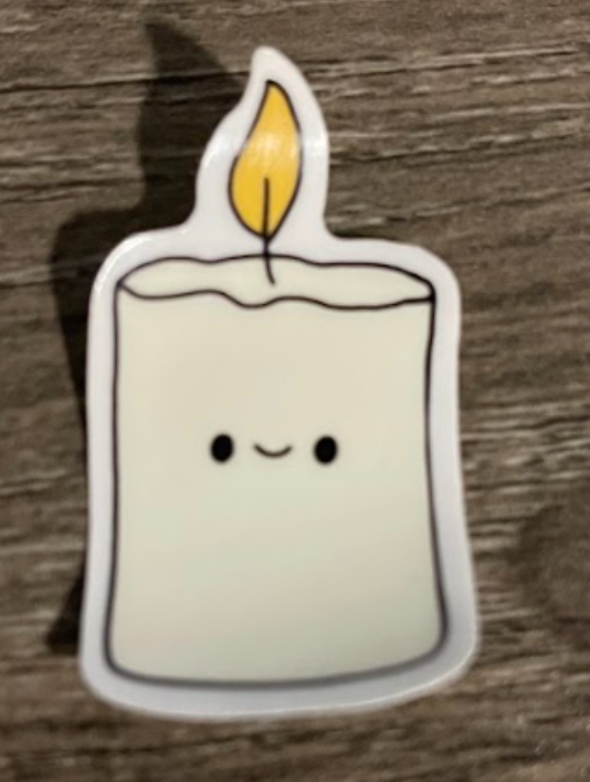 Smiling cartoon candle with a yellow flame.