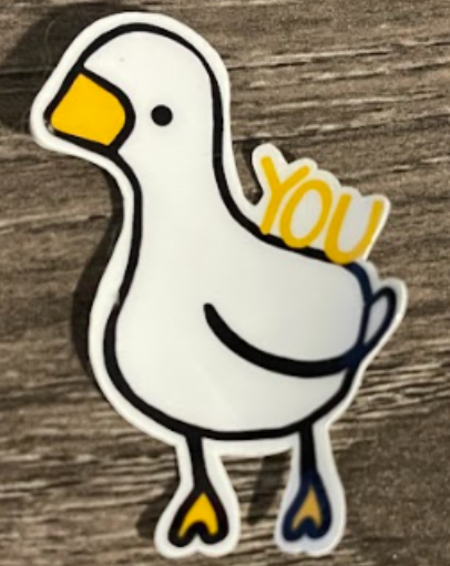 White cartoon goose with a yellow beak and 