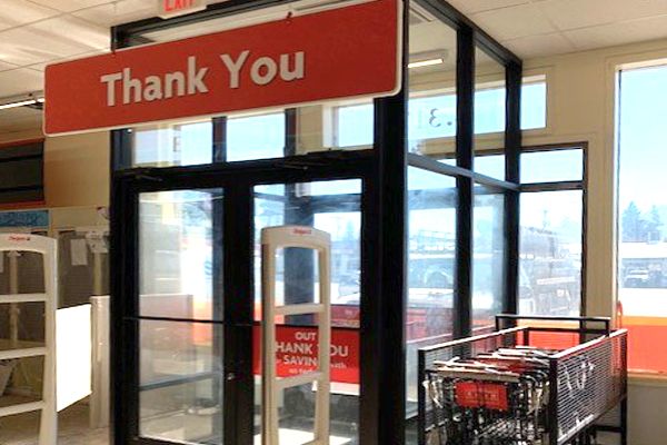 A store with a thank you sign above the door