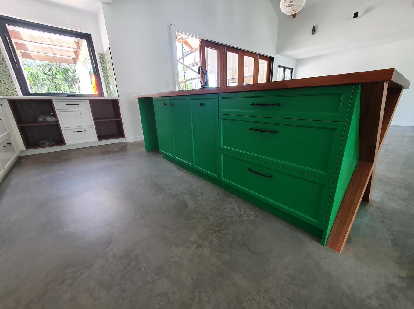 A Kitchen with Cabinets and A Wooden Counter Top — Custombuilt Furnishers in Svensson Heights, QLD