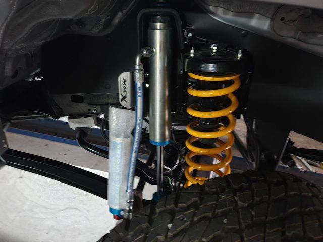 A close up of a shock absorber on a vehicle
