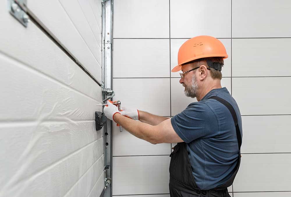 Contractor providing garage door repairs