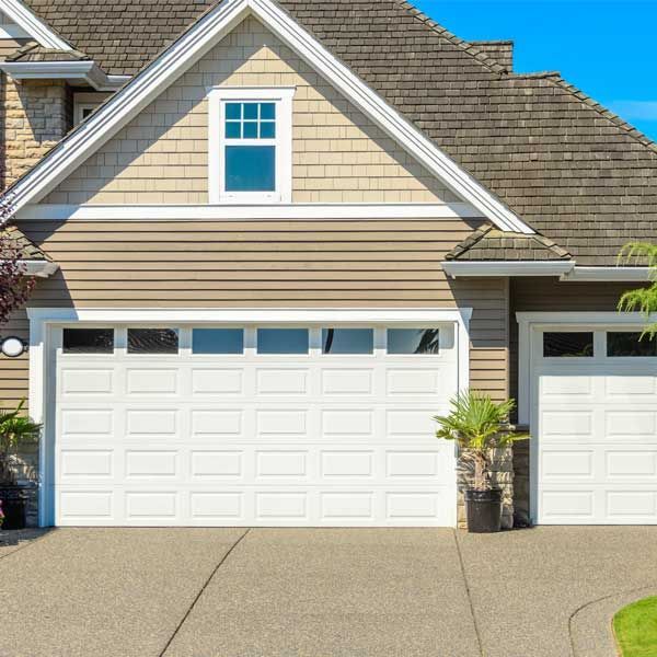 Fragment of a luxury house with a garage door