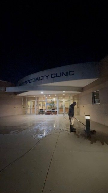 Person shoveling snow in front of 