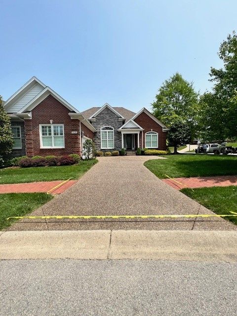 A large brick house with a concrete driveway - Bourbon City Softwash - Louisville, KY