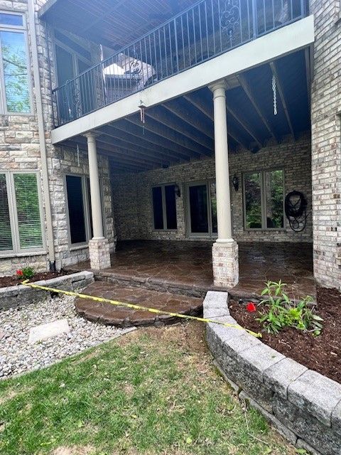 A large brick house with a patio and a balcony. - Bourbon City Softwash - Louisville, KY