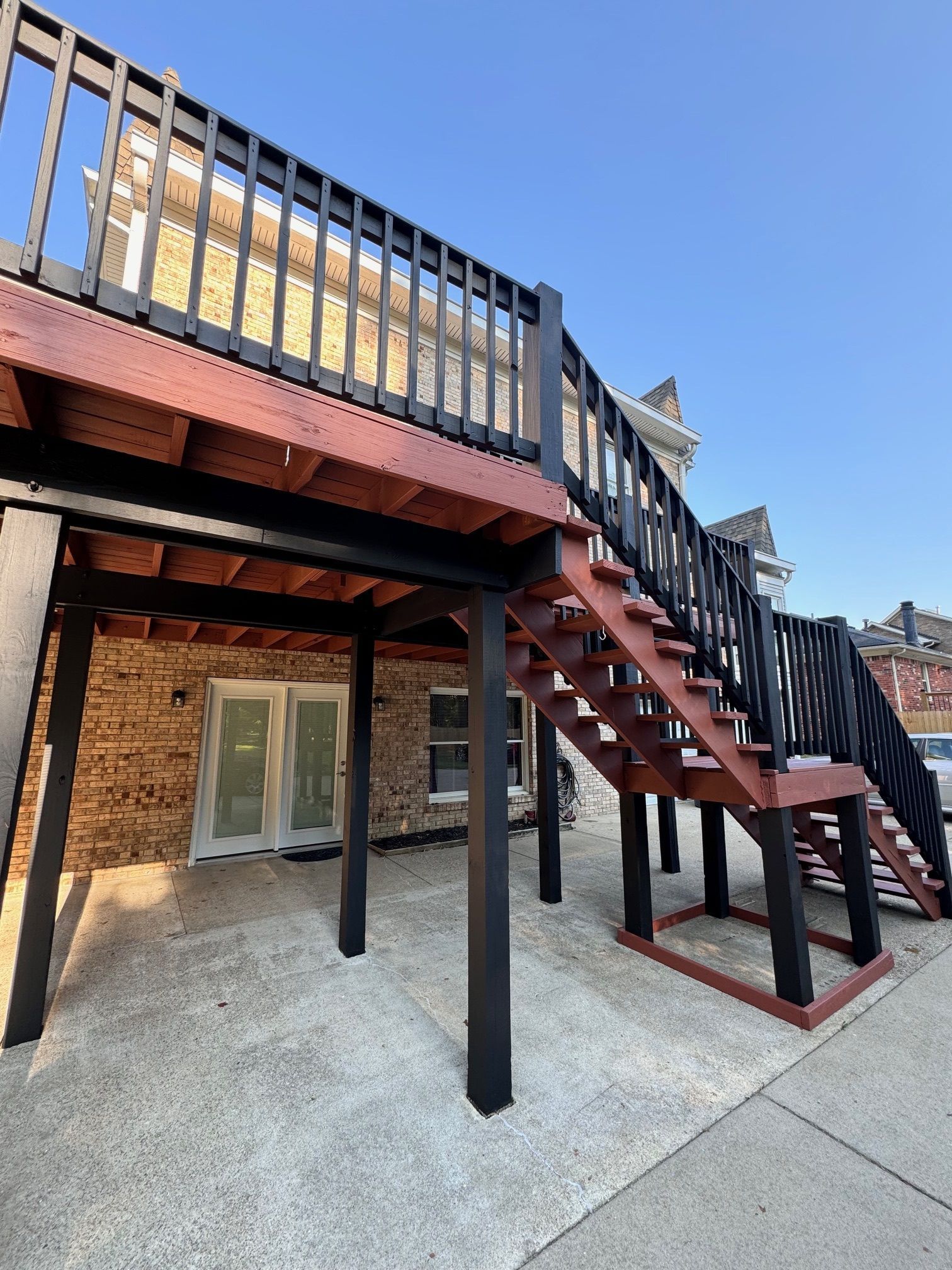 A wooden deck with stairs leading up to it.