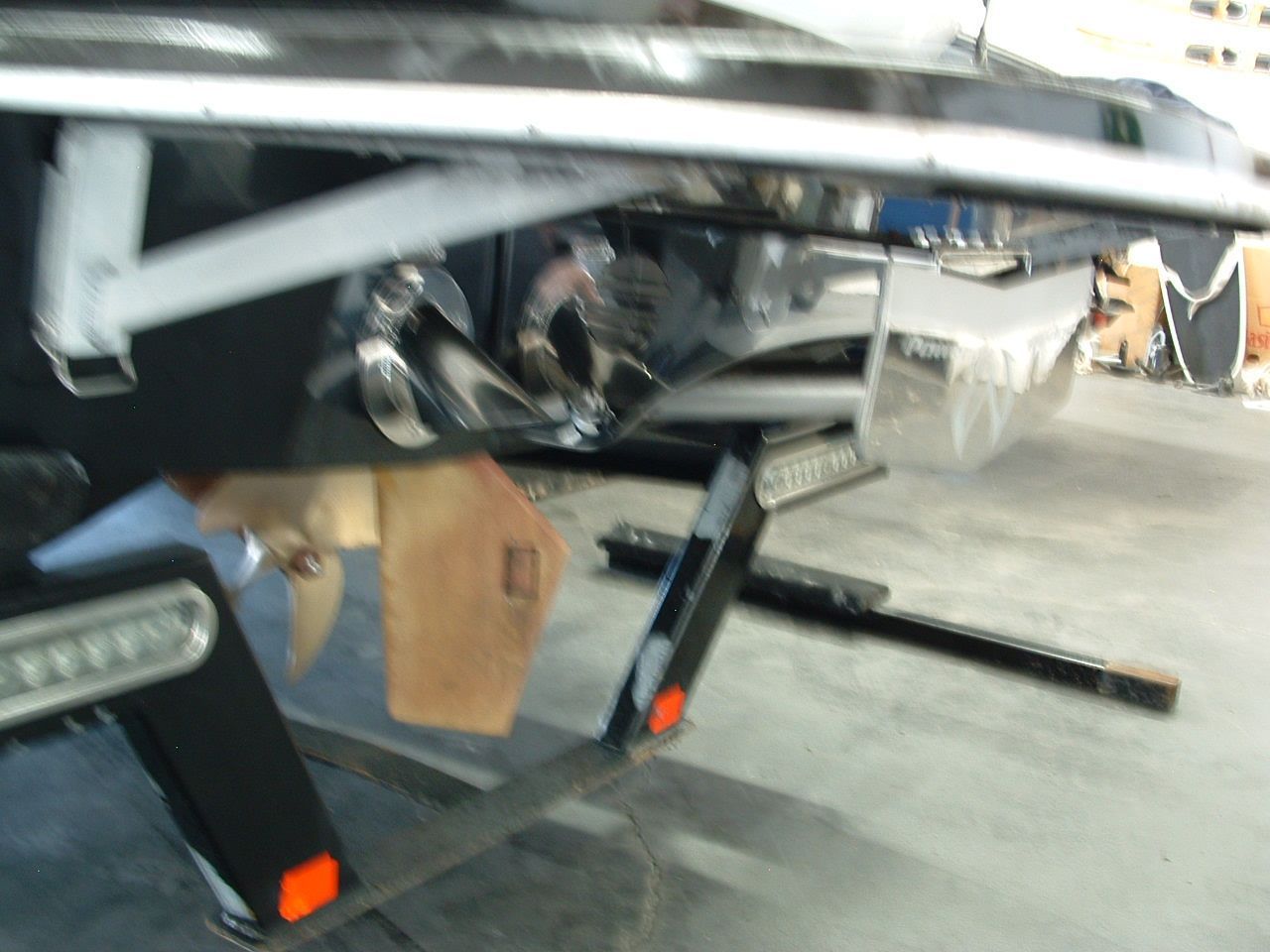 A close up of a boat's propeller with the letter r on it