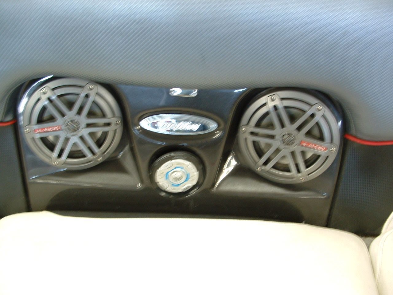 A pair of speakers mounted on the back of a boat