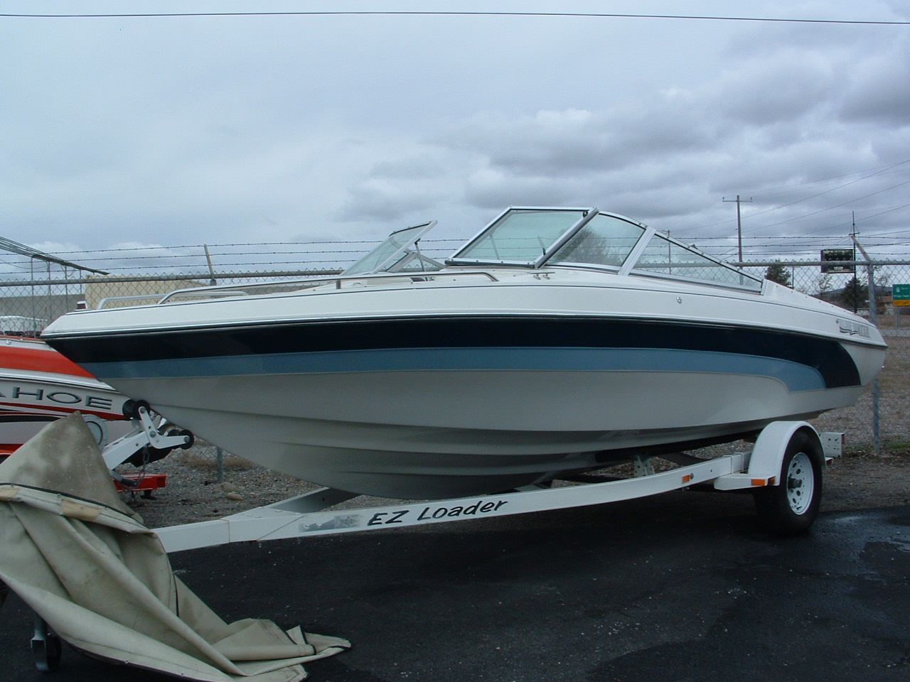 A boat on a trailer that says pacific on it