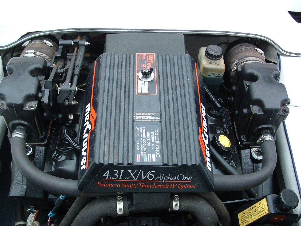 A close up of a mercury 4.31 x16 marine engine