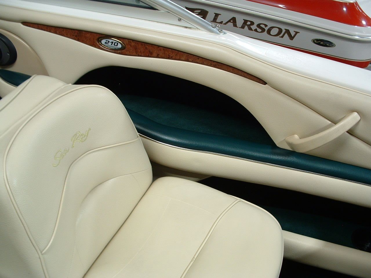 A boat with the name larson on the side of it