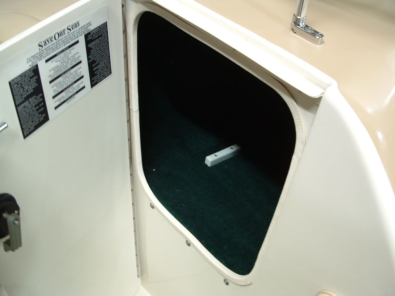 A boat with a sticker on the side that says stuff for sale