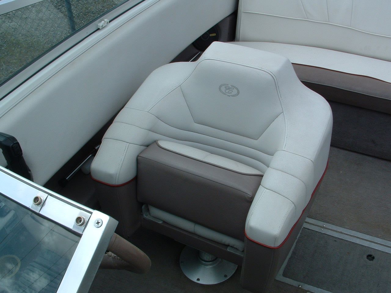 A boat with a seat that has the letter g on it