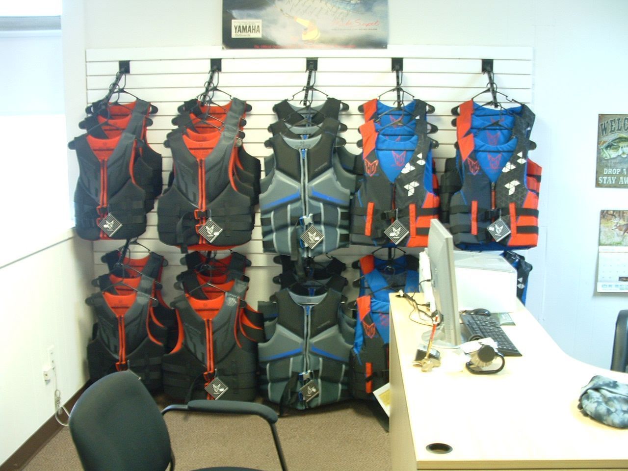 A display of life jackets hanging on a wall